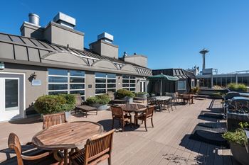 Rooftop patio with waterfront and city views